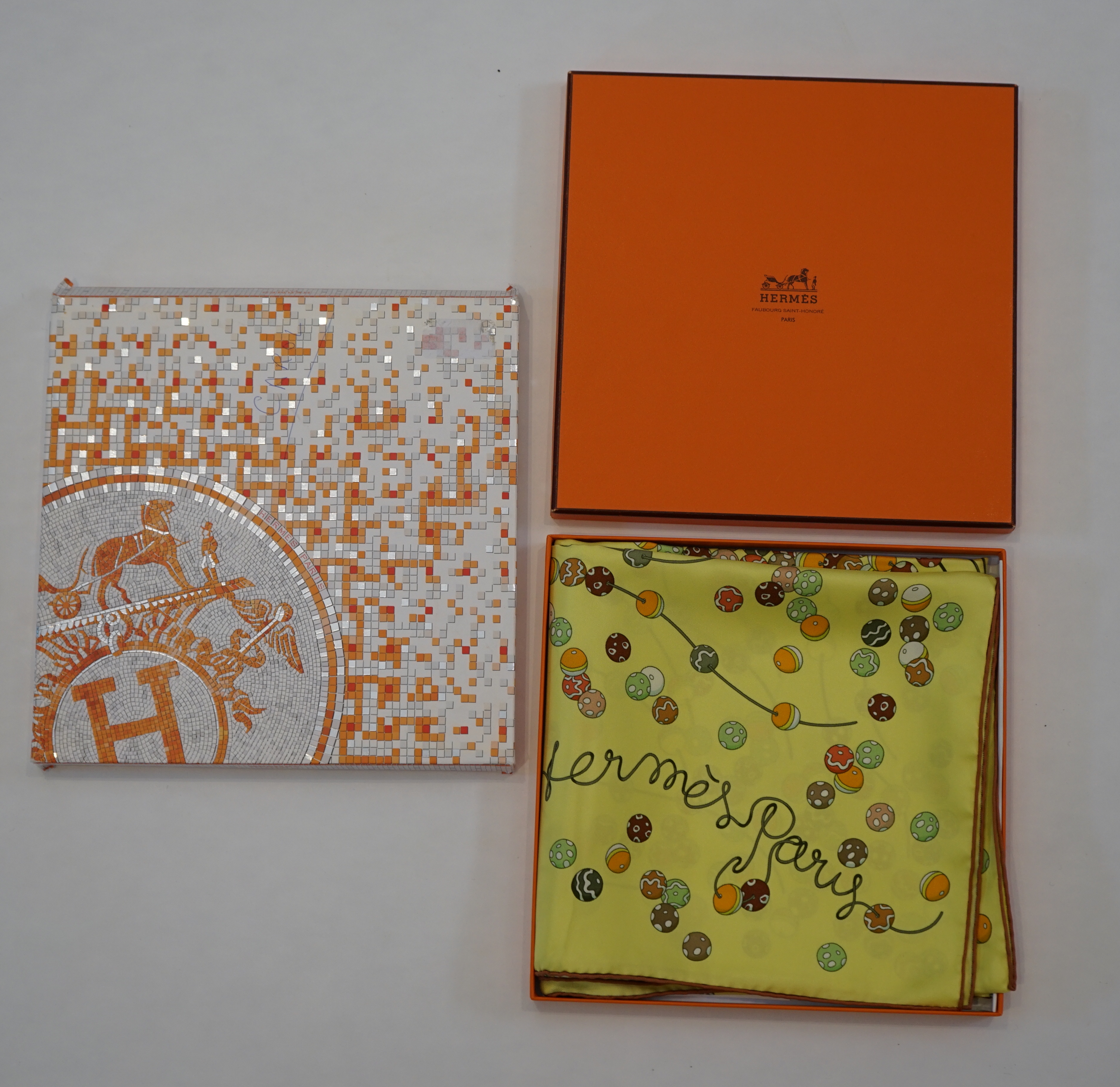 A yellow Hermès 'Dancing Pearls' silk scarf designed by Virginie Jamin, 90cm x 90cm